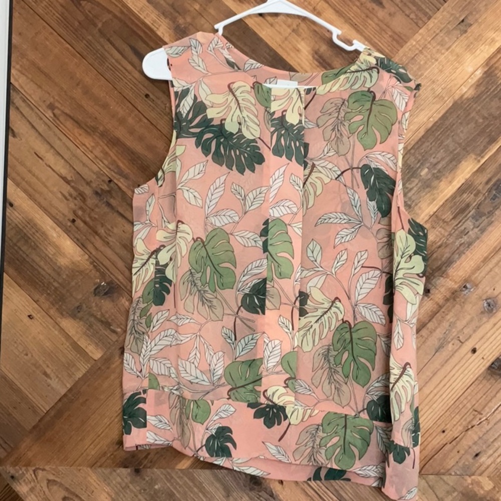 CAbi peach blouse with tropical leaves print.
